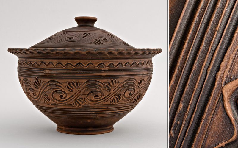 Ceramic brown bowl with lid made of red clay by hand.