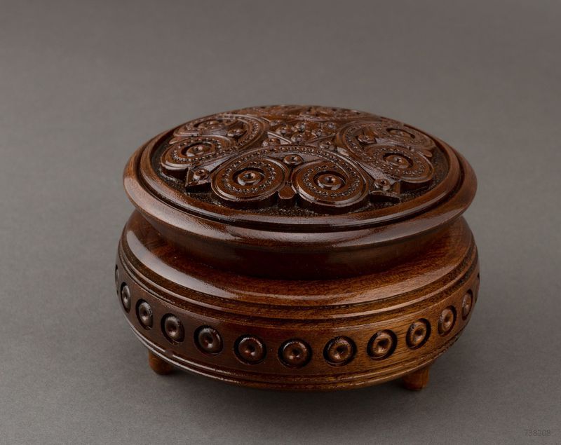 Handmade round wooden decorative jewelry box.