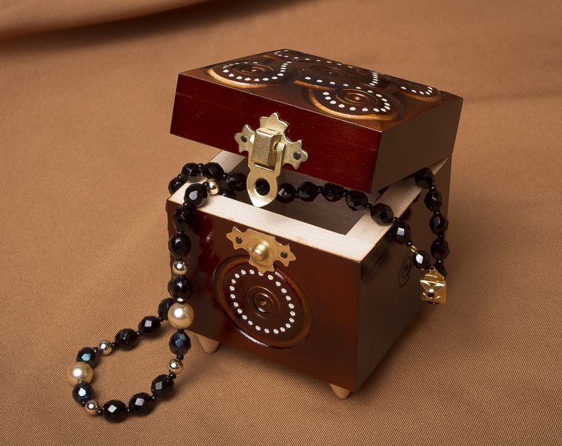 Handmade wooden box inlaid by beads.