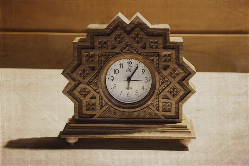 Desk wooden clock with hand carved pattern.