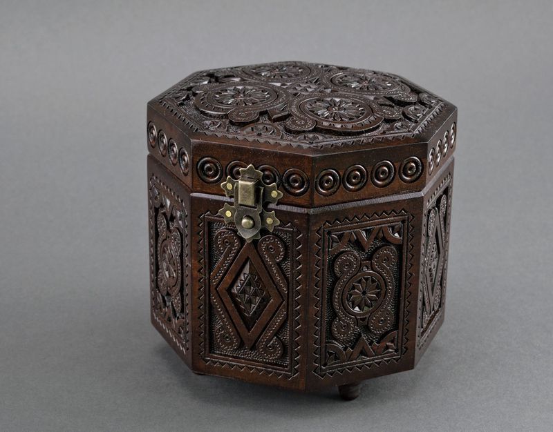 Original carved wooden octahedral box.