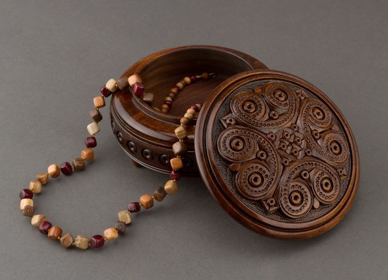 Handmade round wooden decorative jewelry box.