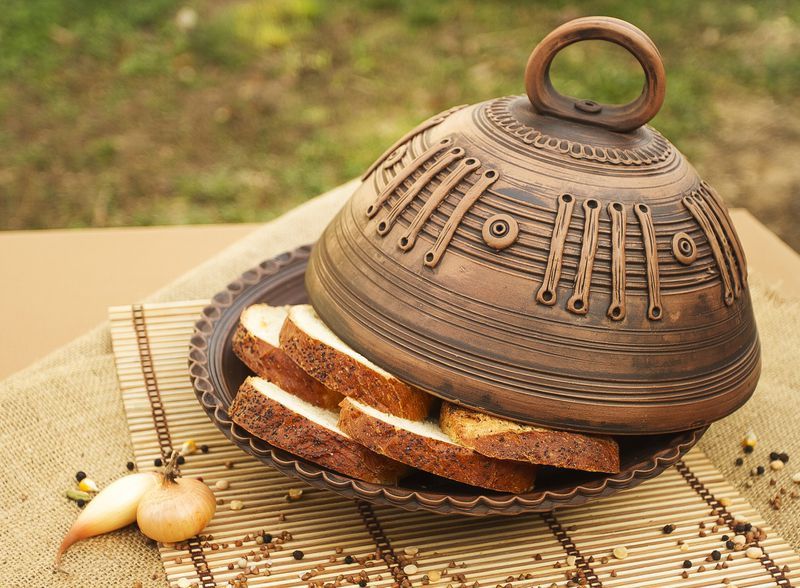 Ceramic dish with lid made of red clay.