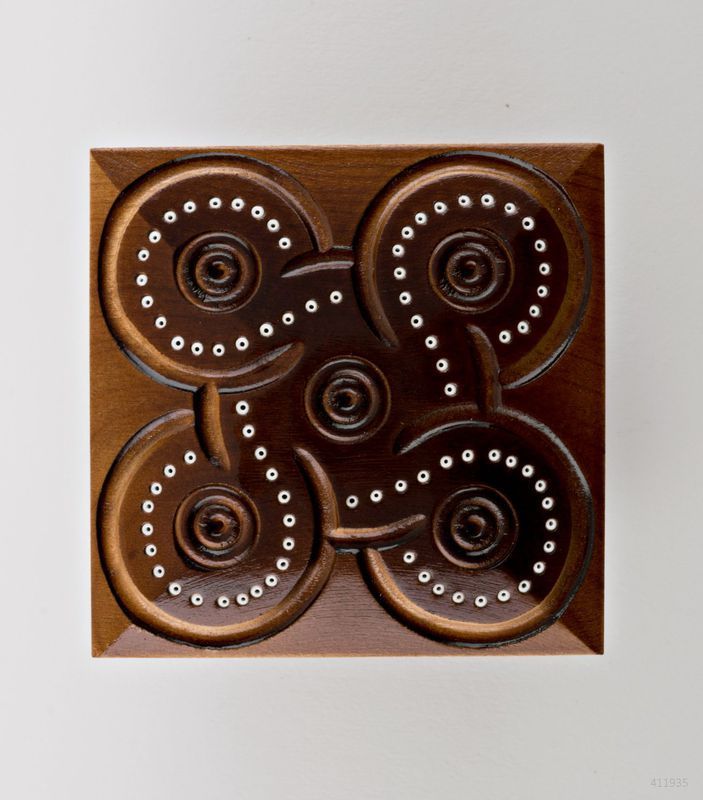 Varnished carved jewelry box inlaid by beads.