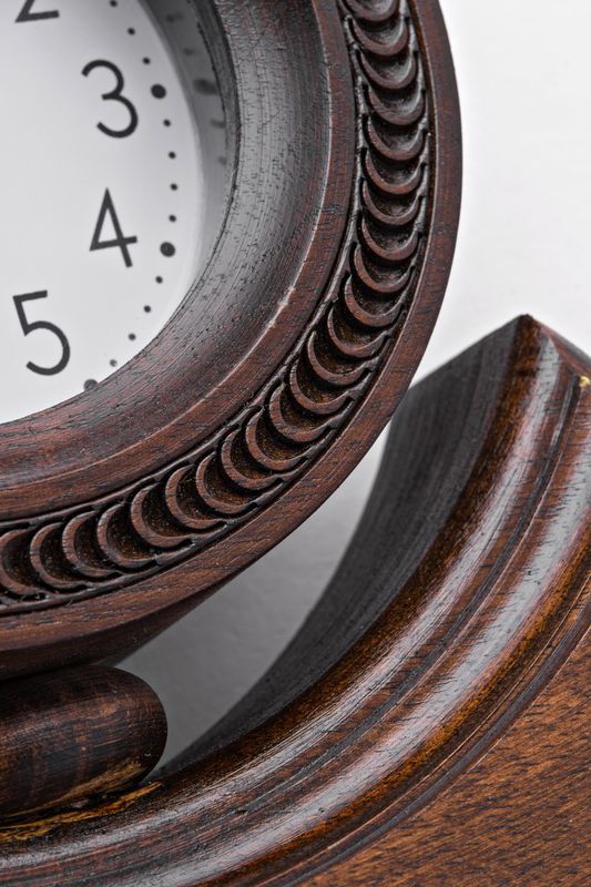 Desk wooden alarm clock with hand carved pattern.