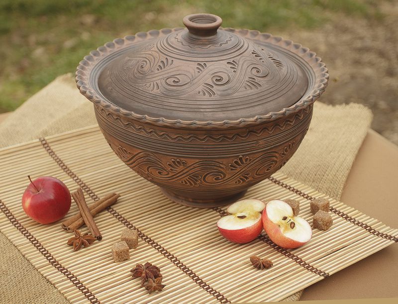 Ceramic brown bowl with lid made of red clay by hand.