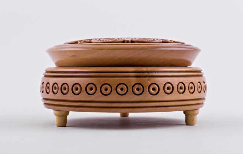 Handmade round wooden jewelry box.