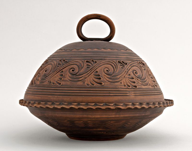 Brown ceramic bowl, plate with lid made of red clay.