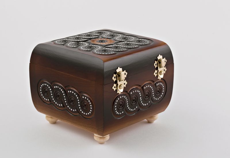 Wooden jewelry box inlaid with beads.