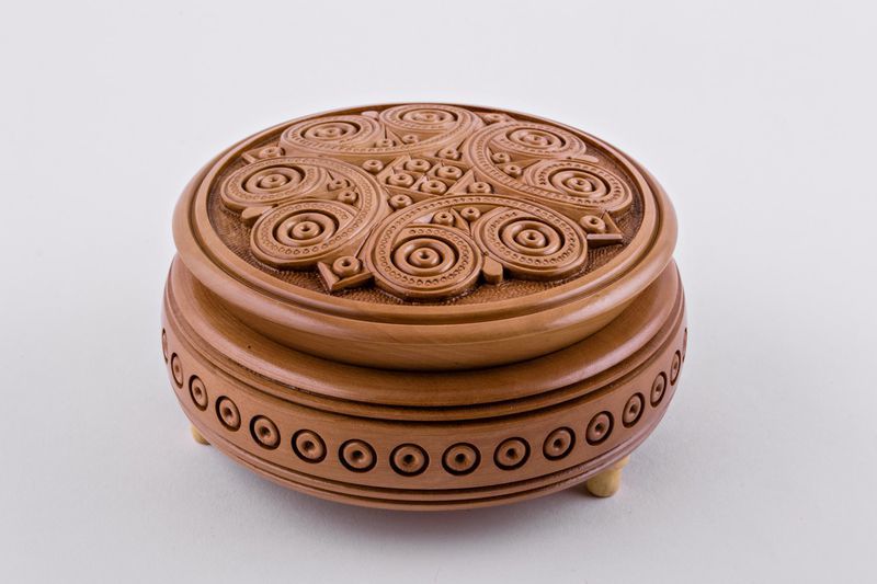 Handmade round wooden jewelry box.