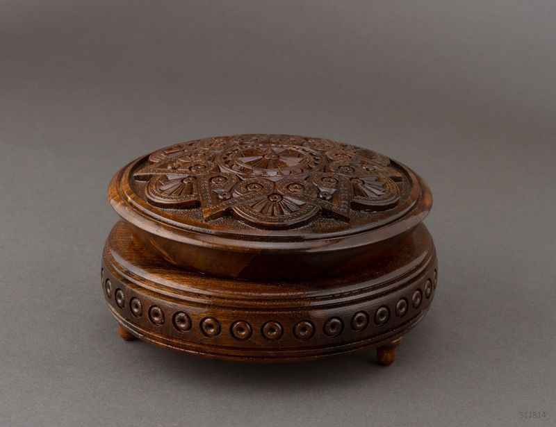 Handmade round wooden jewelry box with carving