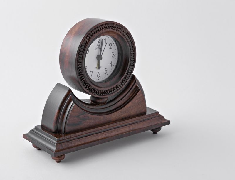 Desk wooden alarm clock with hand carved pattern.