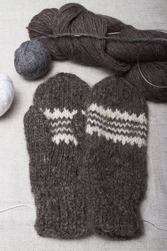 Woolen mittens knitted by hands.  
