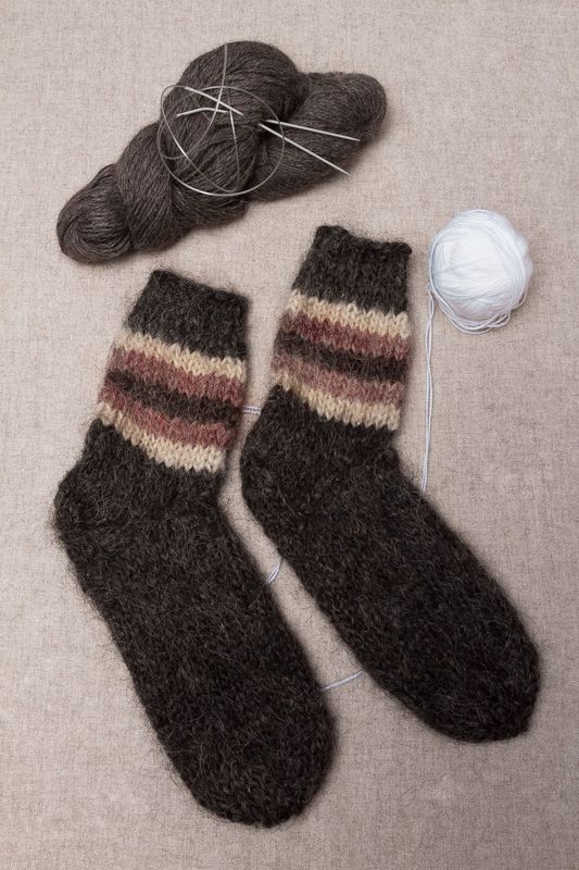 Warm hand knitted woolen socks for women and men.