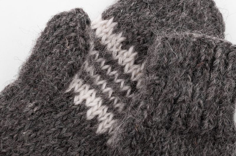 Woolen mittens knitted by hands.