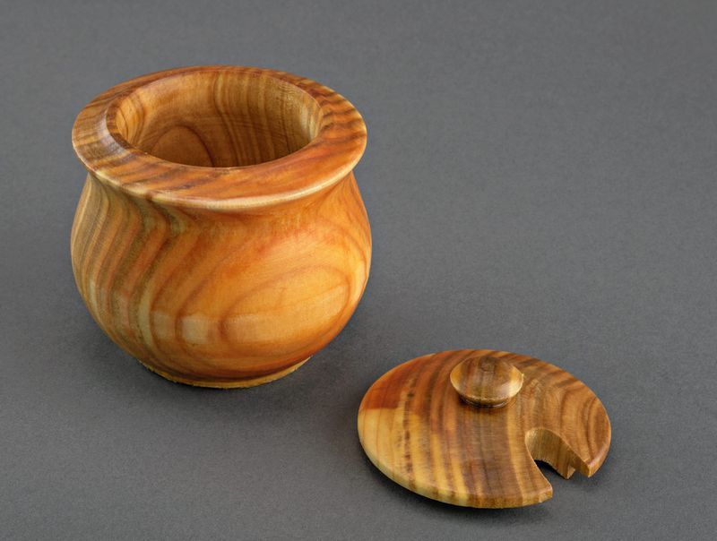 Wooden pot with lid.