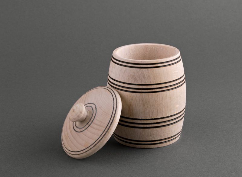 Wooden jar with lid for spices and seasonings.