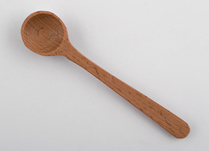 Wooden spoon made by hands.