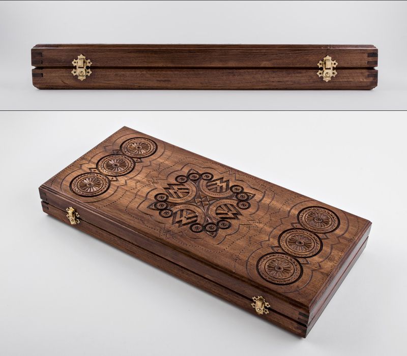 Wooden backgammon with hand carved pattern. 