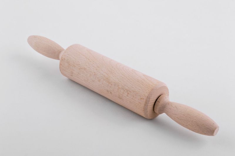 Wooden rolling pin for dough.