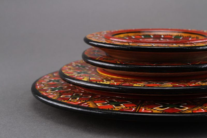 Painted wooden plate set of four plates.