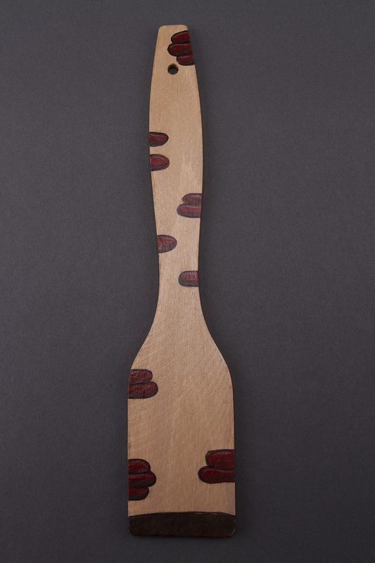 Wooden spatula, utensil made of natural wood.