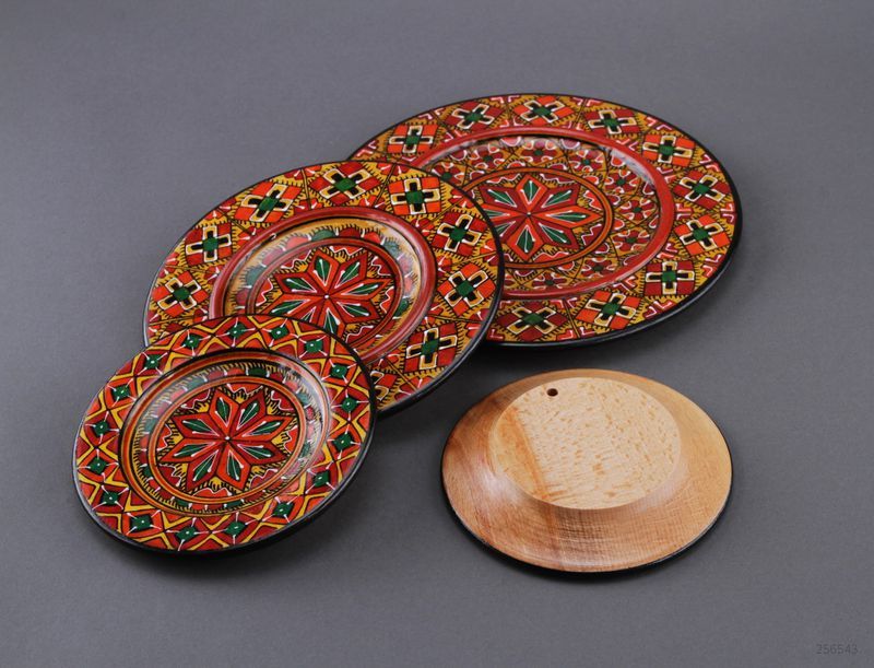 Painted wooden plate set of four plates.