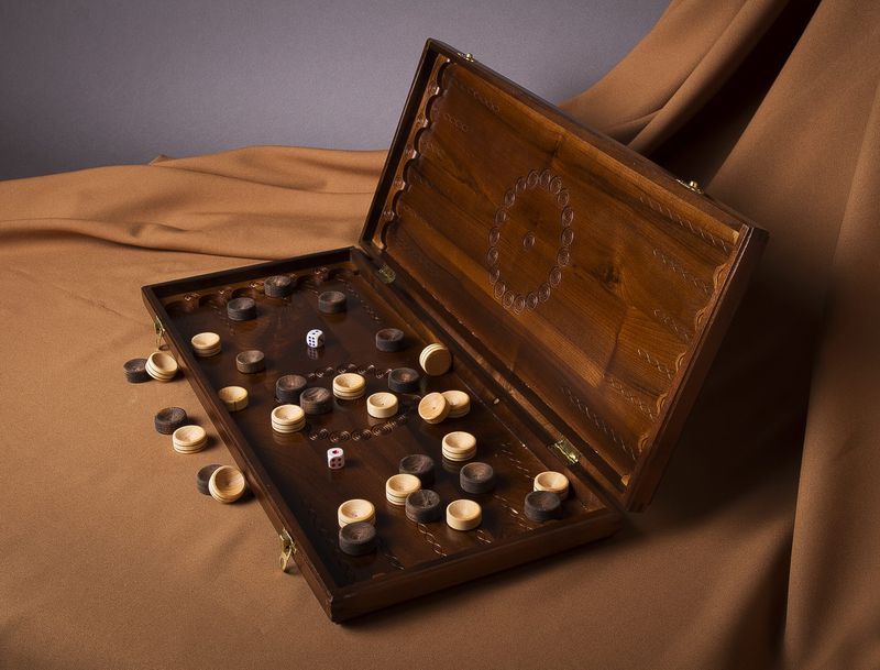 Wooden backgammon with hand carved pattern