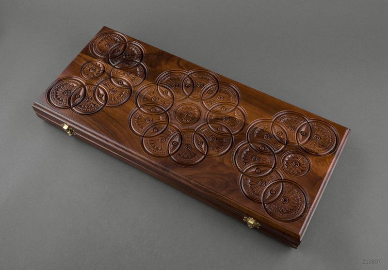 Wooden backgammon with hand carved pattern