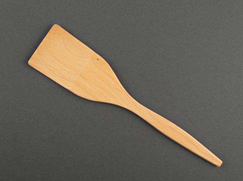 Wooden spatula, utensil made of natural wood.