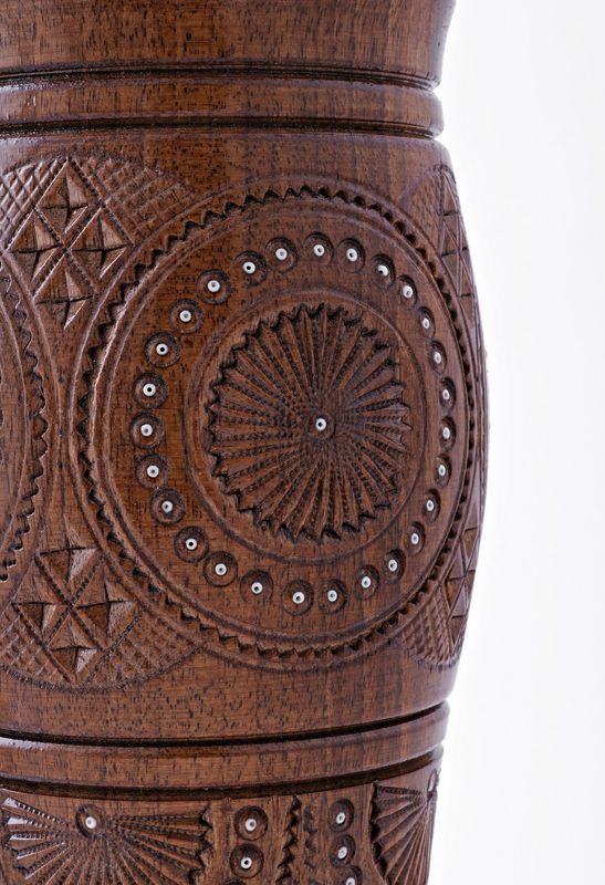 Decorative wooden table vase inlaid with beads. 
