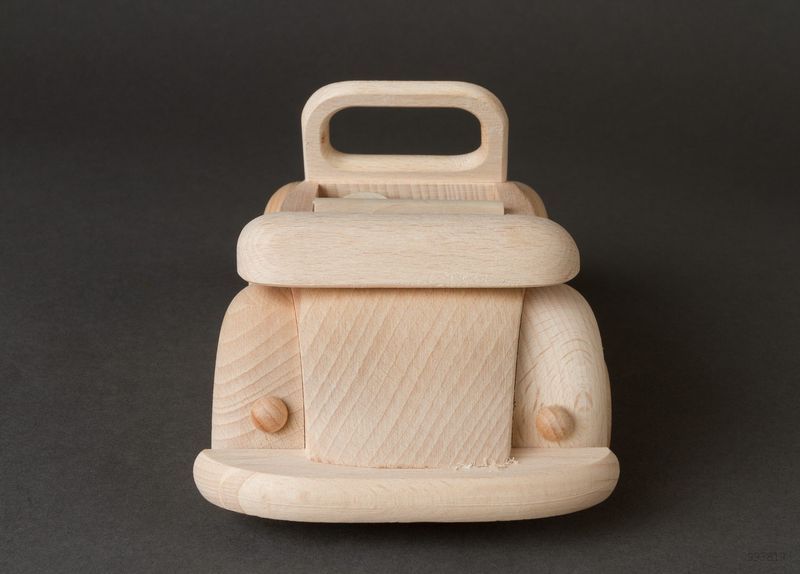 Children&apos;s wooden toy car in retro style for play and creativity.