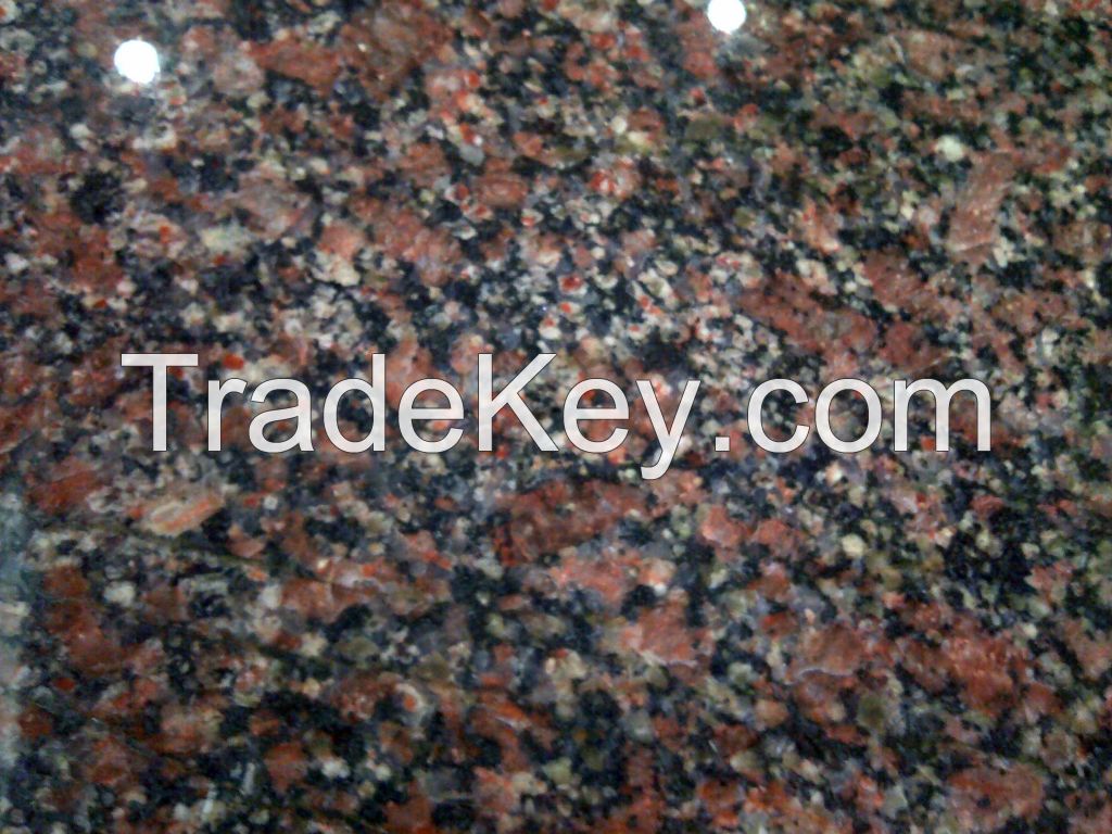 Flesh Red coloured rough granite blocks and processed granite tiles and slabs of required sizes.