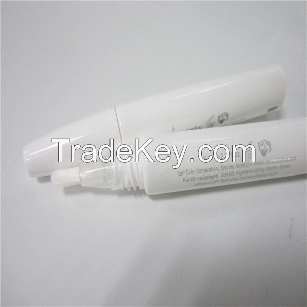 plastic tube with brush applicator