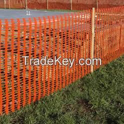 Orange plastic snow fence as warning barrier