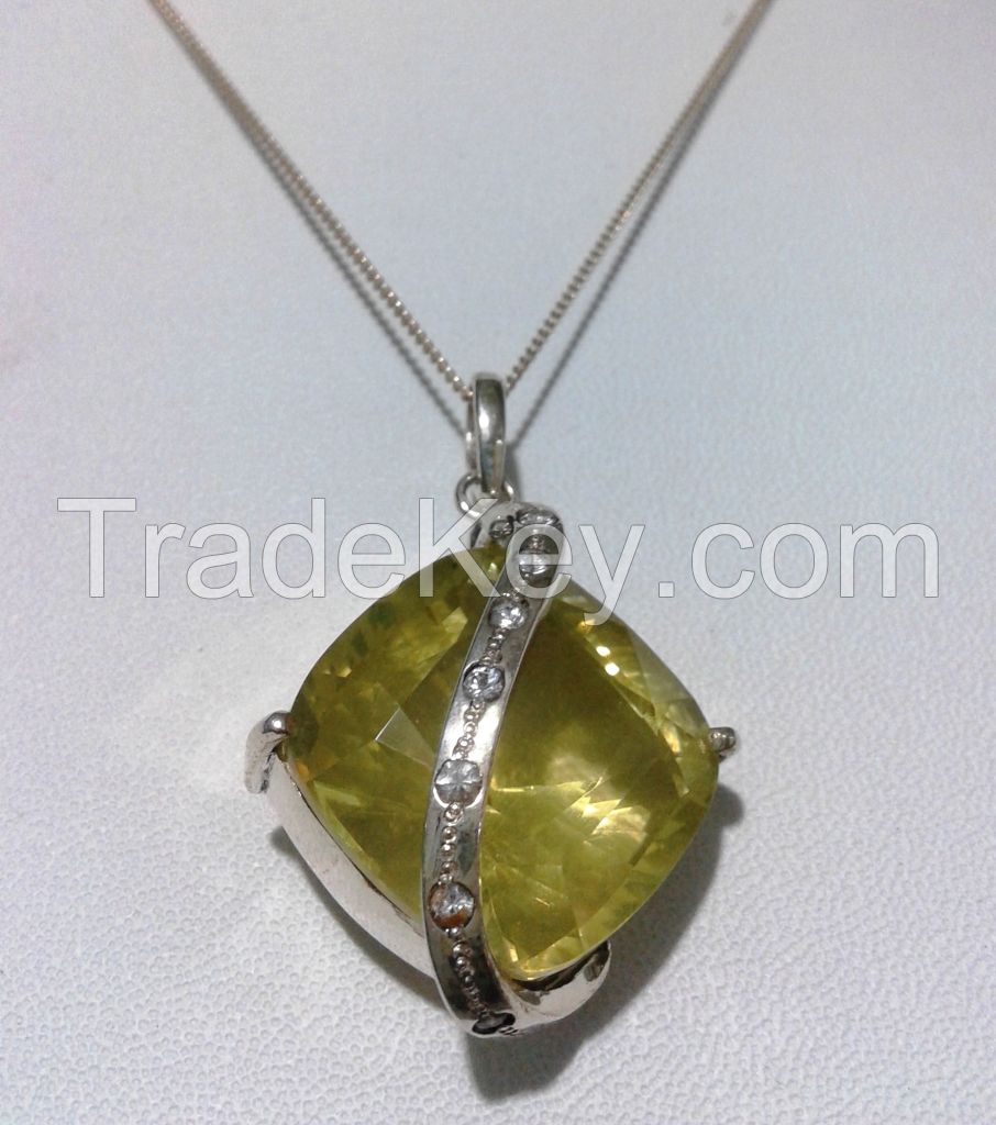 Silver pendant set with Lemon quarts and seven white sapphires