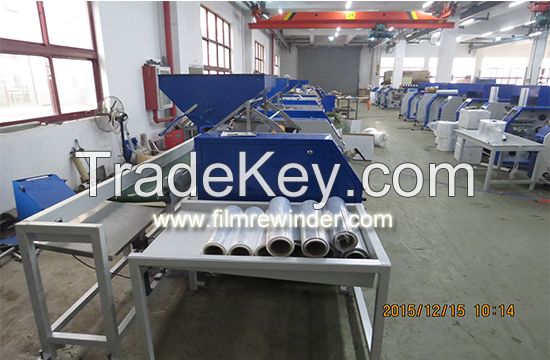 Fully automatic pre stretch film rewinding machine