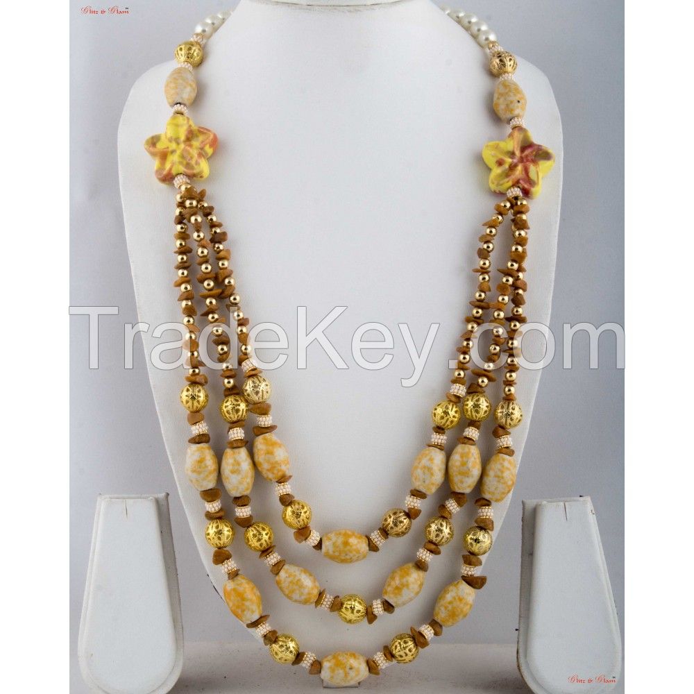 Fashion Necklaces - A bit of floral inspiration with three-layered neck piece attached to white Pearls.