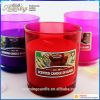 scented candles in colored glass jar 