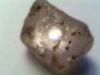 56.00ct. clear rough diamond with triangular flat bottom.