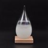 Different size glass storm with wooden basement barometer bottle weather forecast bottle