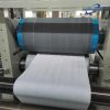 Nonwoven embossing and folding machine