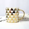 Gold Handle Coffee Mug with Geometric Design