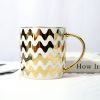 Gold Handle Coffee Mug with Geometric Design