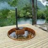 Cedar plungÑ tub with submersible wood stove