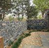 Stone masonry for building stone wall black and gray castle ashlar from field