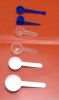 plastic tablespoon and...