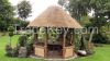 Pavilion. Gazebo with reed roof. Thatched gazebo.