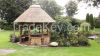 Pavilion. Gazebo with reed roof. Thatched gazebo.