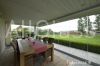 Sliding frameless glazing system